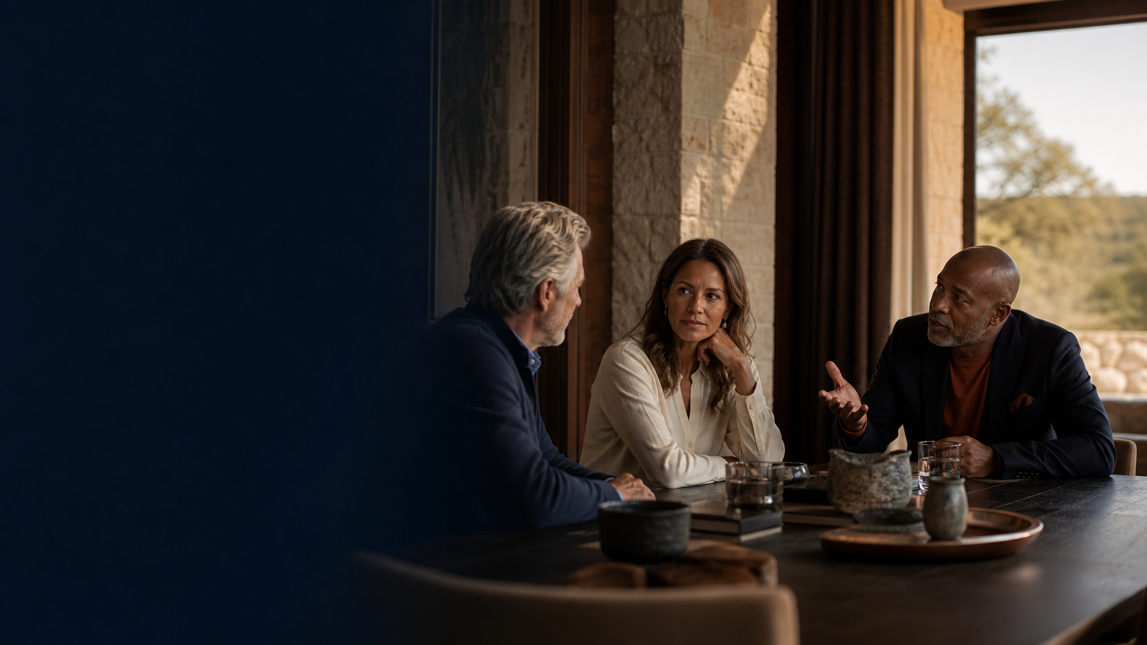 Established business owners in a thoughtful peer conversation